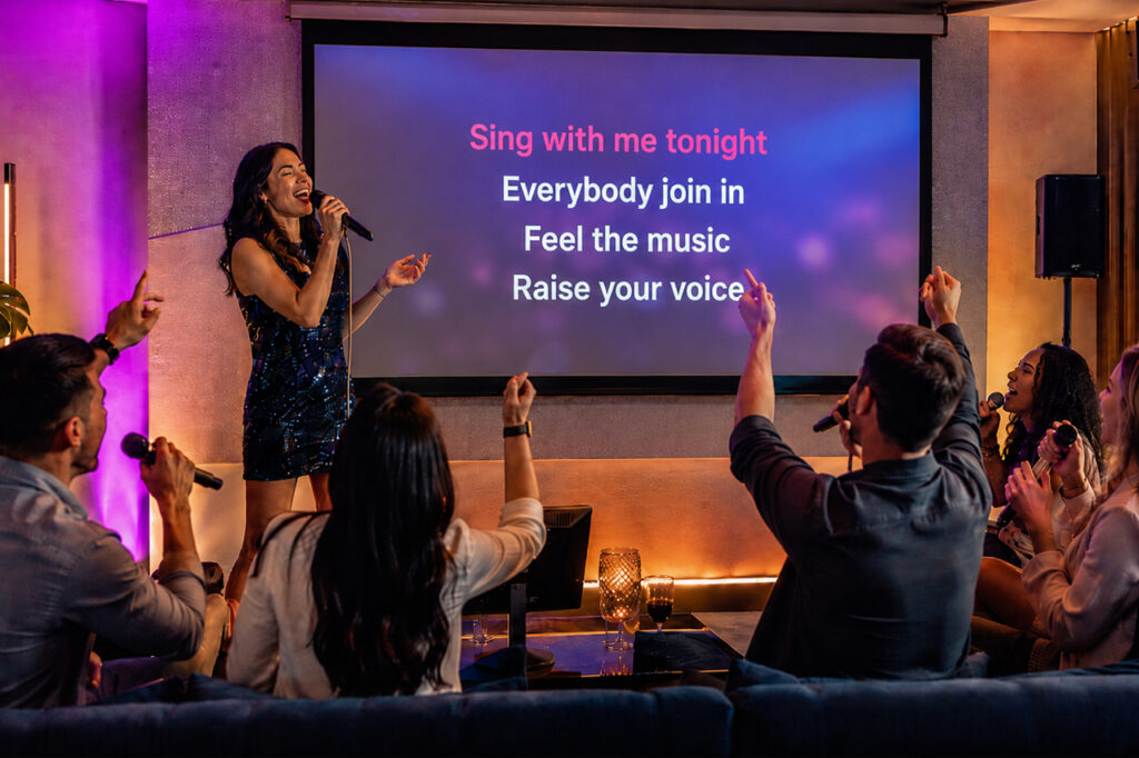 Karaoke party with a projector and screen for guests