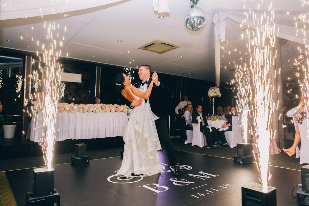 The bride & groom share their first dance with cold sparks.