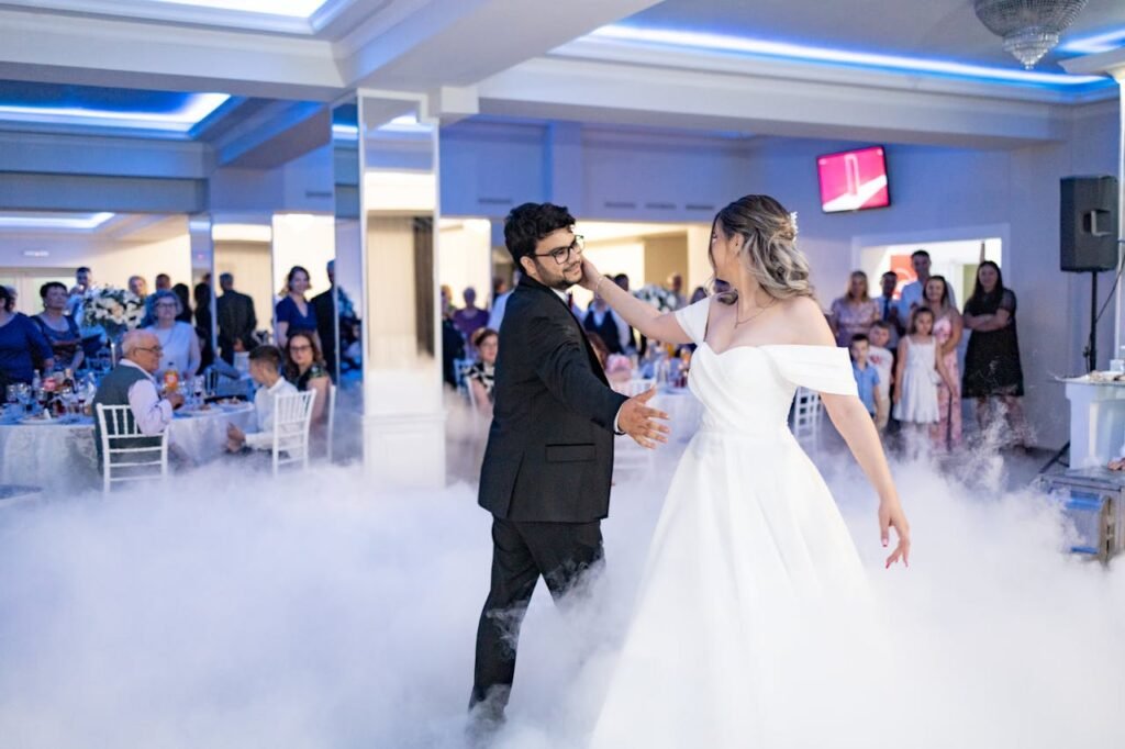 The bride and groom perform their first dance in the clouds with the cloud nine experience.